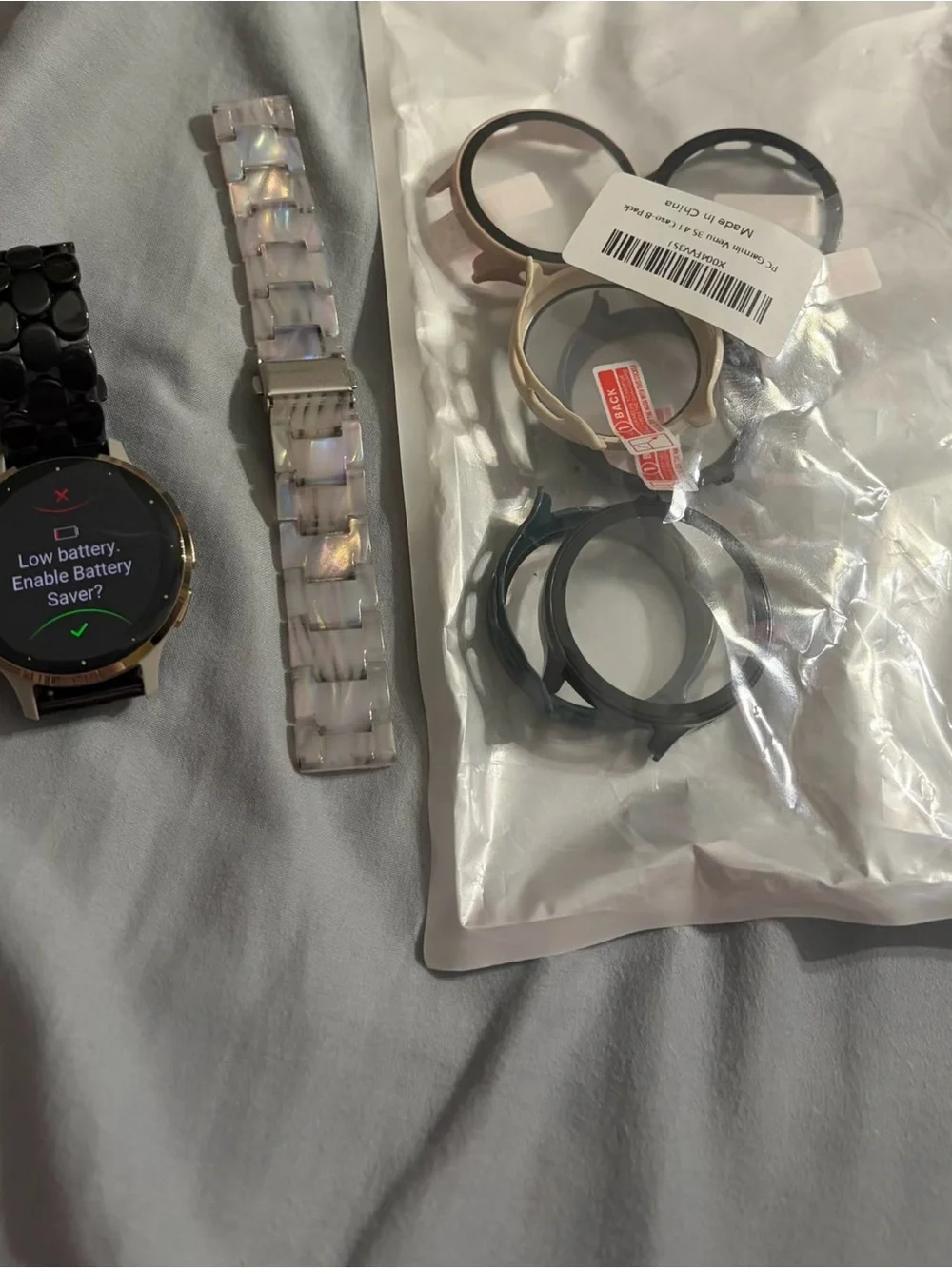 garmin smartwatch with beige case and black metal link band